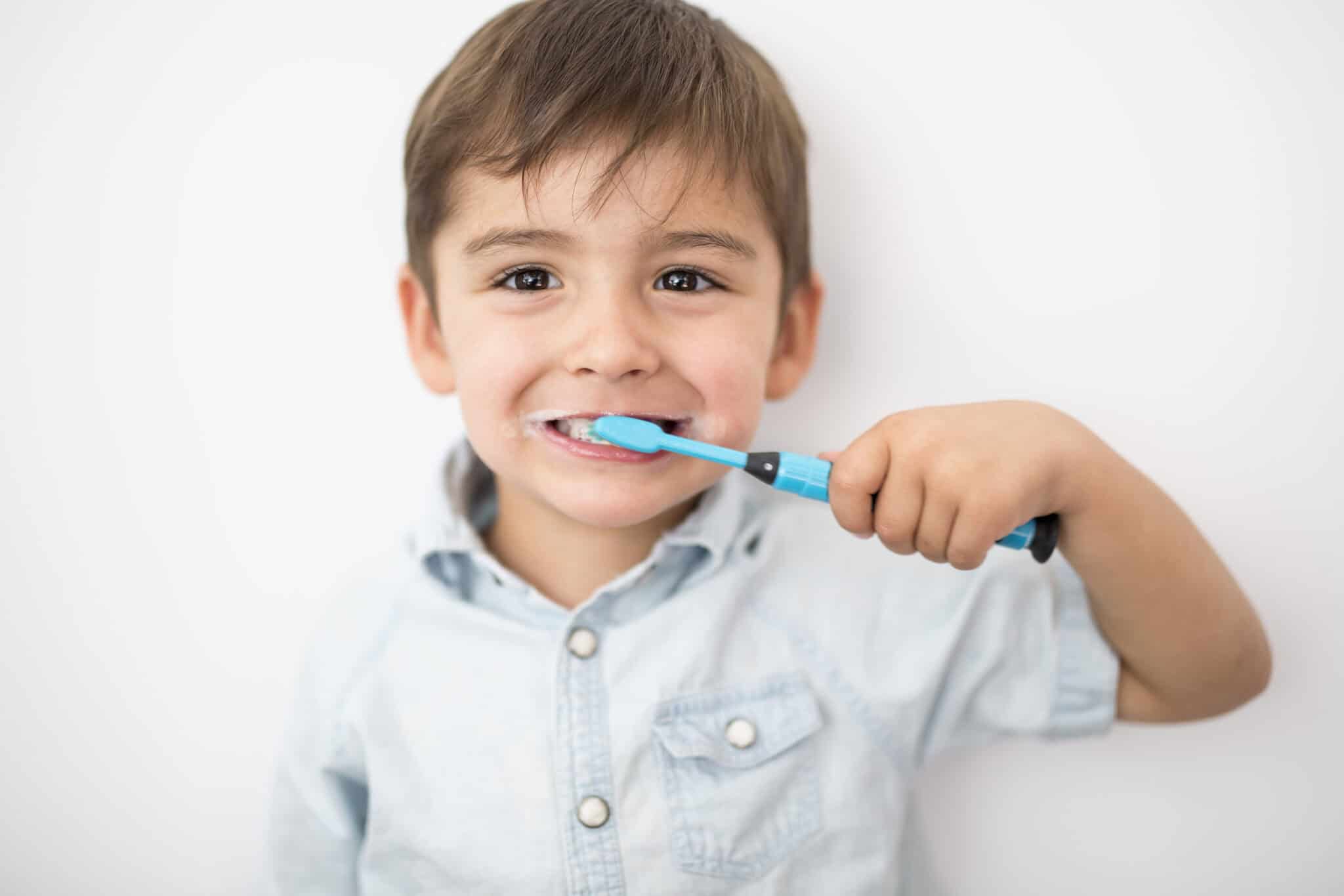 Young boy brushing his teeth